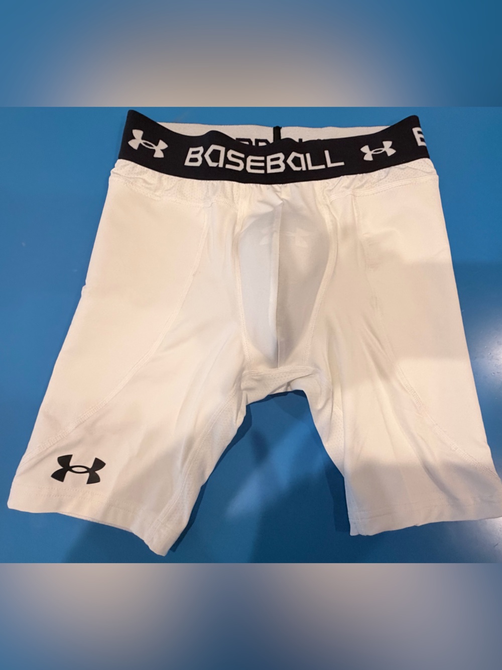 Under Armour White Compression Baseball Shorts with Black Waistband and Logo
